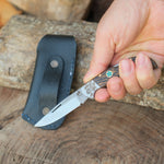 N690 çelikten üretilmiş bu katlanır bıçak, ceviz ağacından yapılan sapı ve hediyelik taşıma kılıfıyla doğa severler için ideal bir seçenektir.