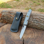 N690 çelikten üretilmiş stabilize saplı, 21 cm uzunluğunda el yapımı katlanır bıçak